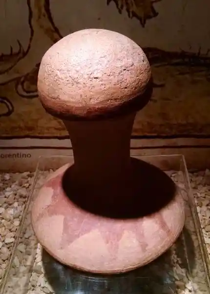 Phalli with solar disc design at the bottom